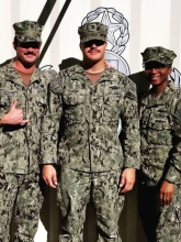 photo of LTJG Garcia with 2 other service members